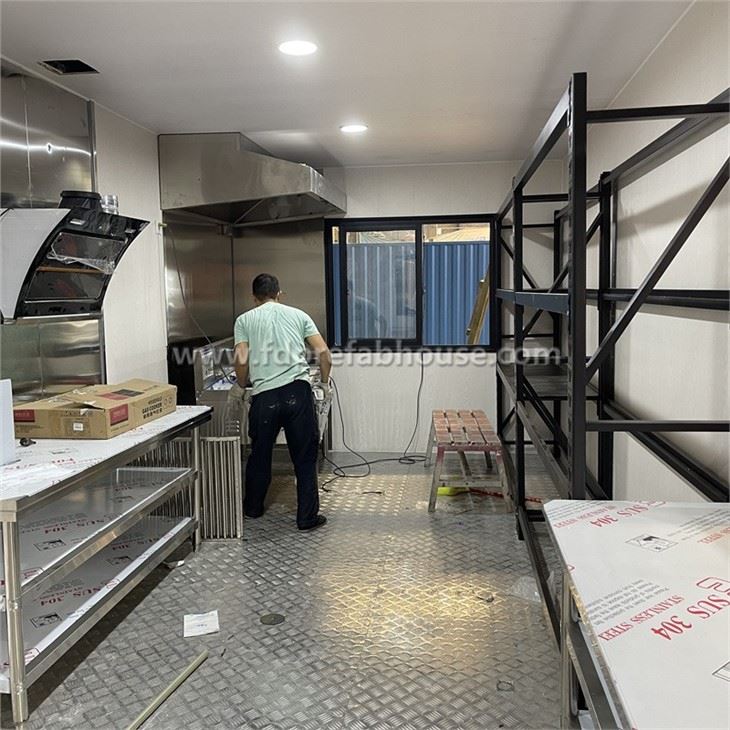 Decorated Container Kitchen With Metal Carved Panels